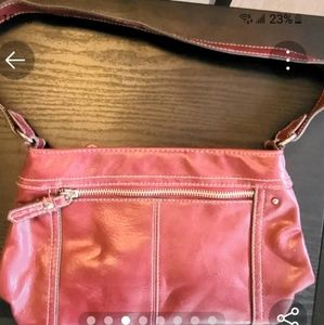 Womans red leather hand purse.